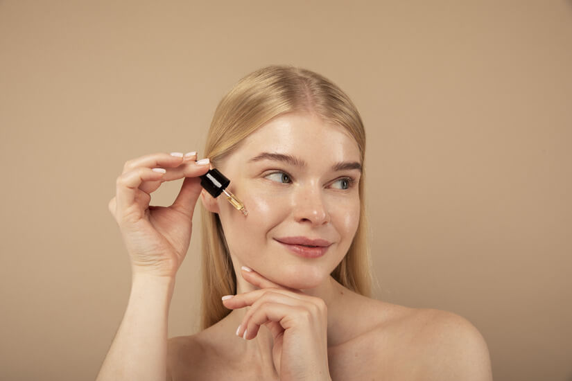 close up woman with beauty product
