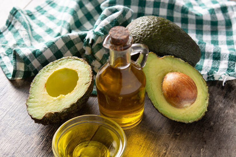oil ripe fresh avocado rustic wooden table