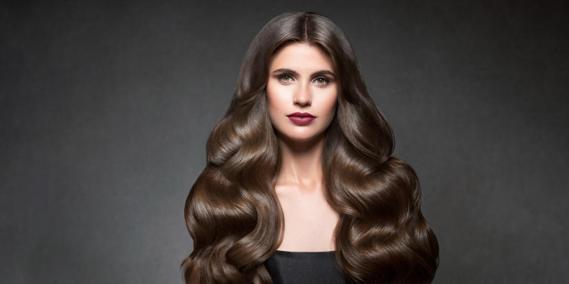 a woman with long wavy hair