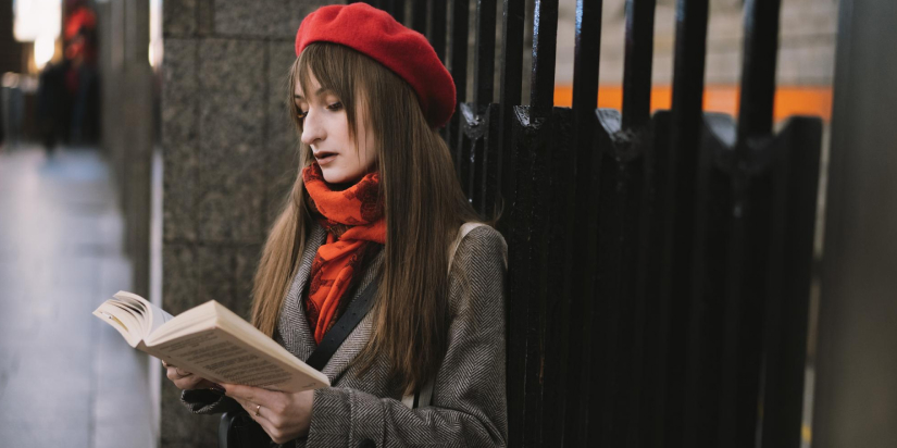 girl reading book while waiting for casting
